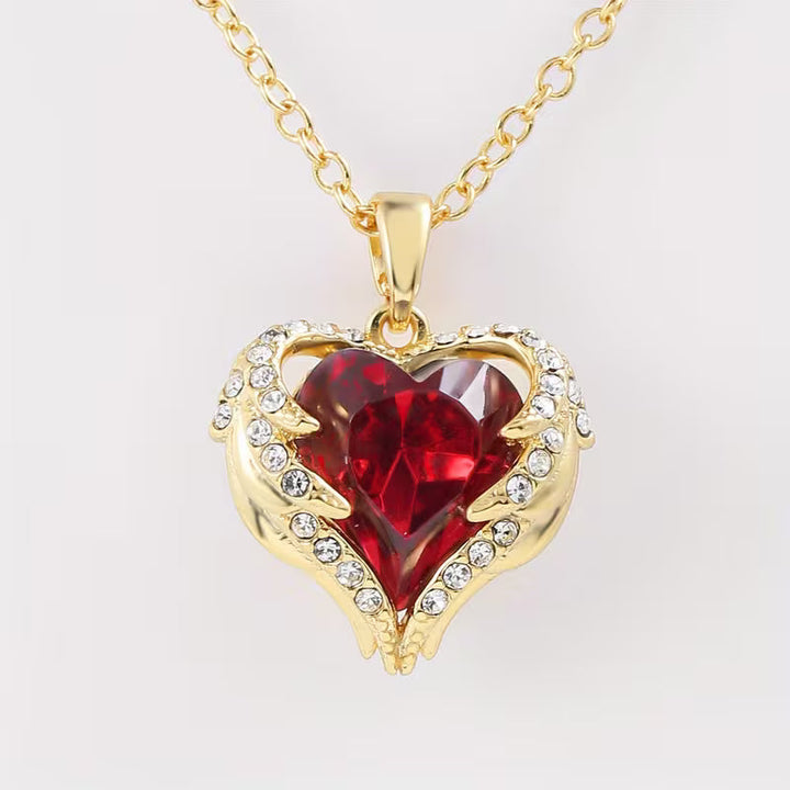 Soft Embrace gold necklace with ruby heart