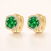 Elegant gold earrings with emerald detail
