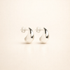 Elegant white gold earrings with subtle dangling elements