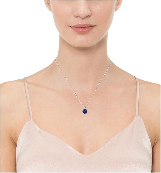 Elegant white gold necklace with round-cut sapphire