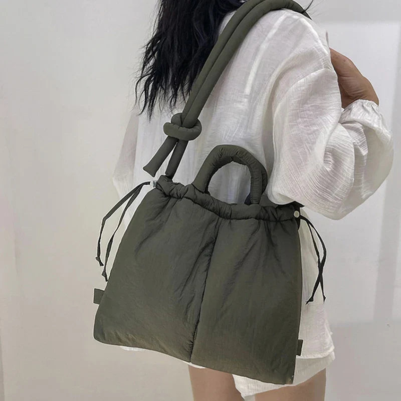 https://cdn.shopify.com/s/files/1/0952/6175/3687/files/adeline-womens-quilted-puffer-handbag-2.webp?v=1777156910