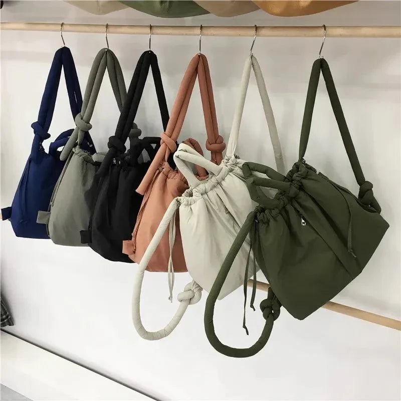 https://cdn.shopify.com/s/files/1/0952/6175/3687/files/adeline-womens-quilted-puffer-handbag-7.webp?v=1777156920