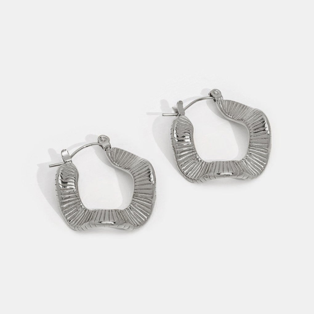Elegant silver hoops with subtle waves