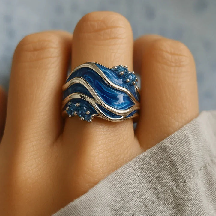 Elegant gold ring with wave motif