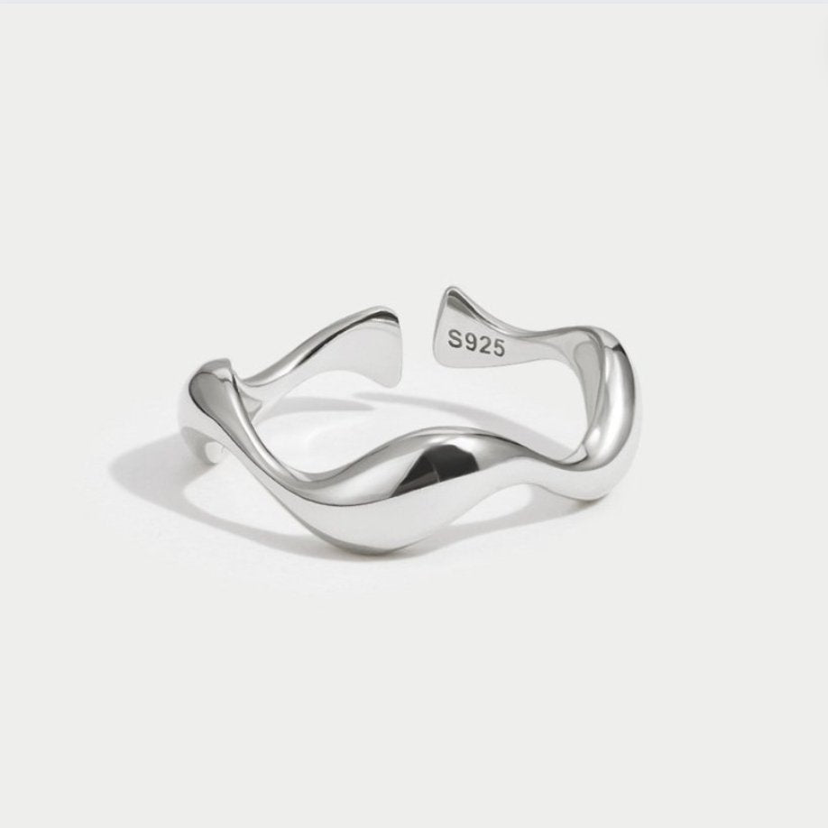 Elegant silver wave ring with refined lines